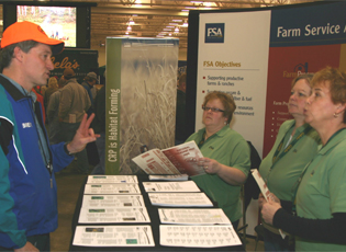 A landowner (left) at the conference asks Green County PT Natalie Ponkauskas (far right), Dane County PT Kelly Palmer, and Dodge County CED Susan Blachowiak listen to a landowner’s questions during the conference.