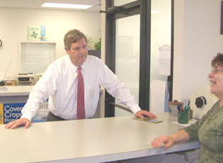 Secretary Tom Vilsack chats with Program Assistant Lynn Dabler at the Cecil County Service Center in Elkton, Md., during a recent surprise visit.
