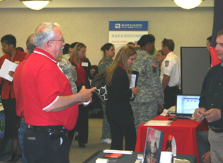 Attendees visited recruiting booths to find out about private sector and government employment opportunities. 