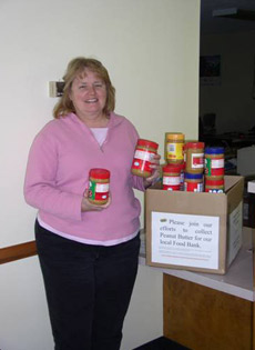 Rebecca Drake, a local farmer, brings her donation to the office.
