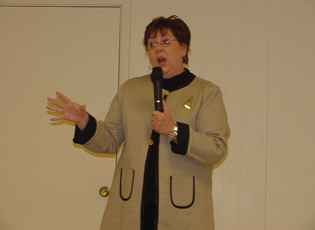 Speaker Susie Oberdahlhoff gives a humorous presentation on her experiences as a farm wife.