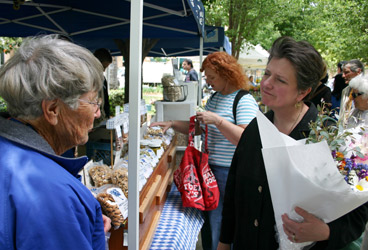 Jane Dewey (left) of Dewey Farms in Yolo, California, chats with Deputy Secretary Merrigan (right) at the Sacramento farmers market and provides her first-hand input on agricultural issues.